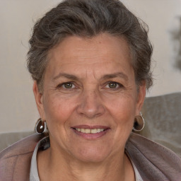 Joyful white middle-aged female with short  brown hair and brown eyes