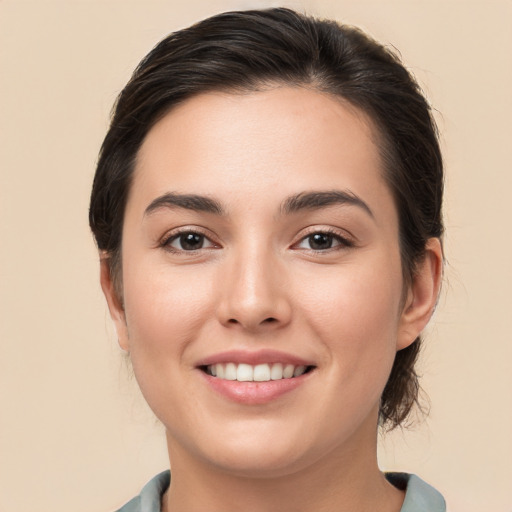 Joyful white young-adult female with medium  brown hair and brown eyes