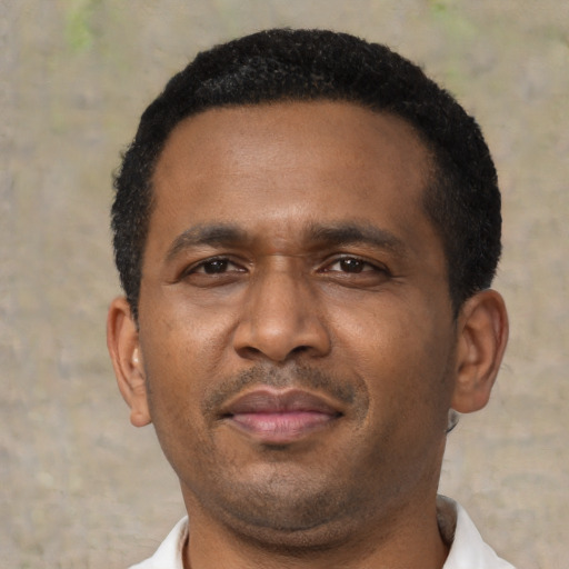 Neutral latino adult male with short  black hair and brown eyes