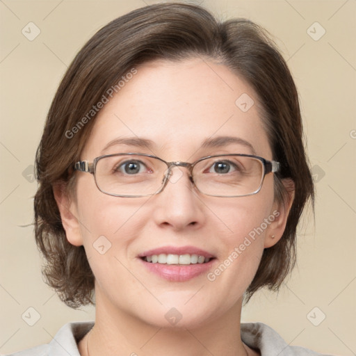 Joyful white adult female with medium  brown hair and grey eyes