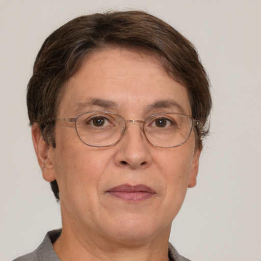 Neutral white middle-aged female with short  brown hair and brown eyes