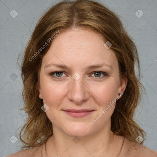 Joyful white young-adult female with medium  brown hair and blue eyes