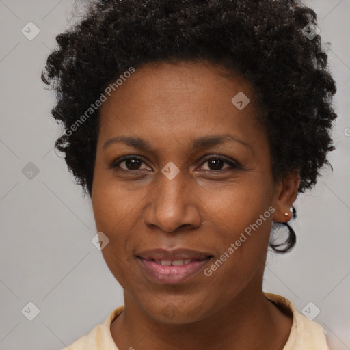 Joyful black adult female with short  brown hair and brown eyes