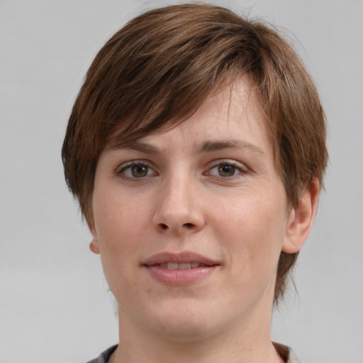 Joyful white young-adult female with medium  brown hair and grey eyes