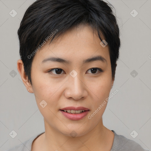 Joyful asian young-adult female with short  brown hair and brown eyes