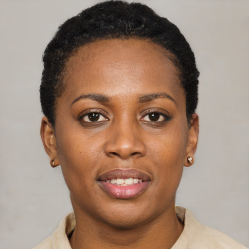 Joyful latino young-adult female with short  black hair and brown eyes