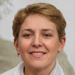 Joyful white adult female with short  brown hair and grey eyes