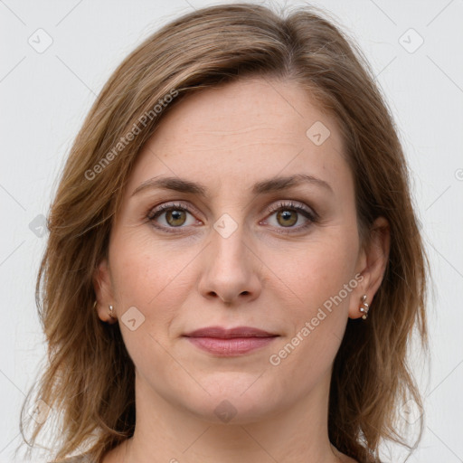 Joyful white young-adult female with long  brown hair and green eyes