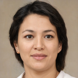 Joyful white adult female with medium  brown hair and brown eyes