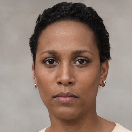 Neutral black young-adult female with short  black hair and brown eyes