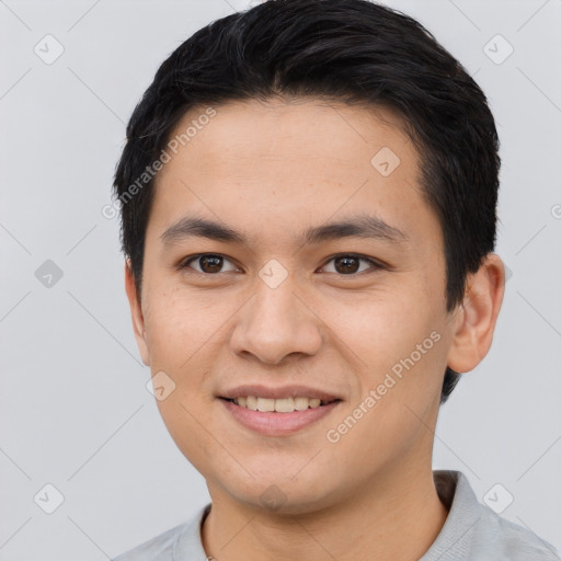 Joyful asian young-adult male with short  brown hair and brown eyes