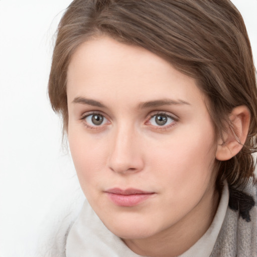 Neutral white young-adult female with medium  brown hair and grey eyes