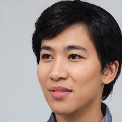 Joyful asian young-adult male with medium  black hair and brown eyes