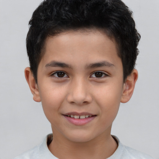 Joyful asian child male with short  brown hair and brown eyes