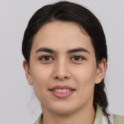 Joyful white young-adult female with medium  brown hair and brown eyes