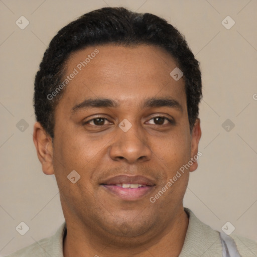 Joyful black young-adult male with short  brown hair and brown eyes