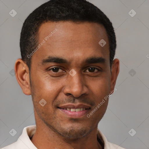 Joyful latino young-adult male with short  brown hair and brown eyes