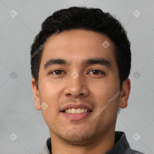 Joyful latino young-adult male with short  black hair and brown eyes