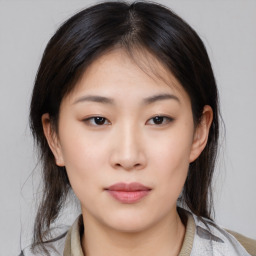 Neutral asian young-adult female with medium  brown hair and brown eyes