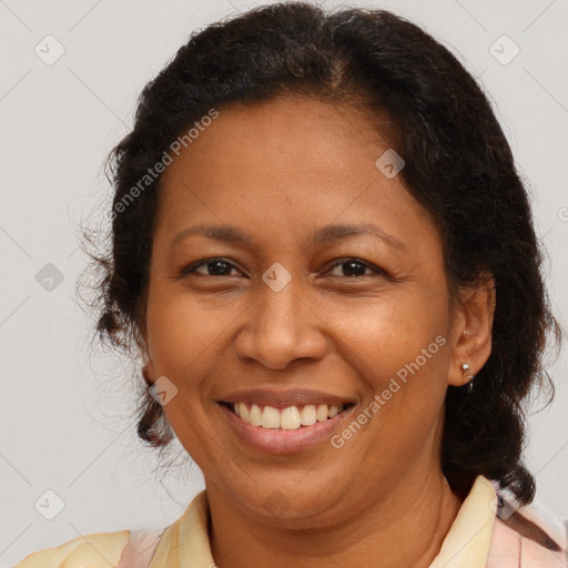 Joyful latino adult female with medium  brown hair and brown eyes