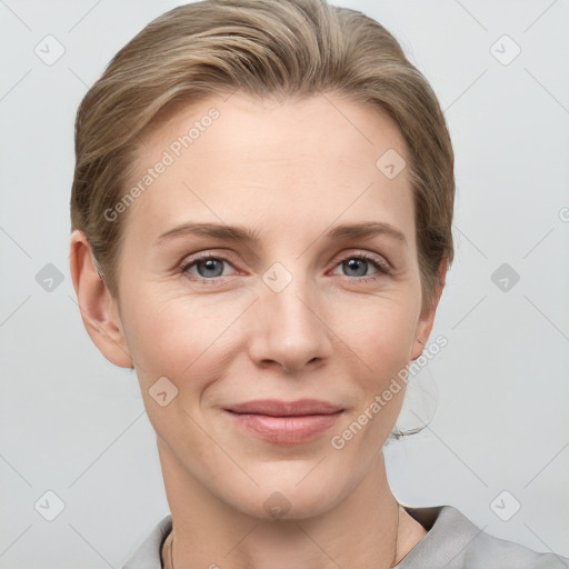 Joyful white young-adult female with short  brown hair and grey eyes