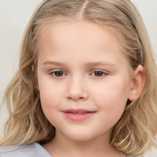 Joyful white child female with long  brown hair and grey eyes