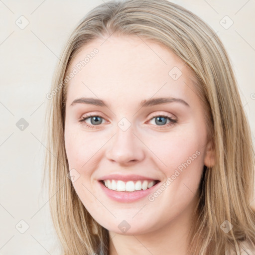 Joyful white young-adult female with long  brown hair and blue eyes