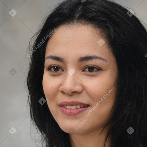 Joyful asian young-adult female with long  brown hair and brown eyes