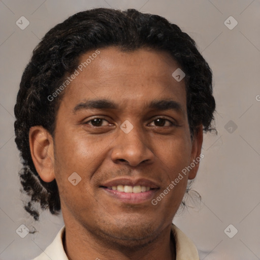 Joyful latino young-adult male with short  brown hair and brown eyes