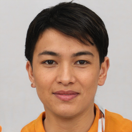 Joyful asian young-adult male with short  brown hair and brown eyes