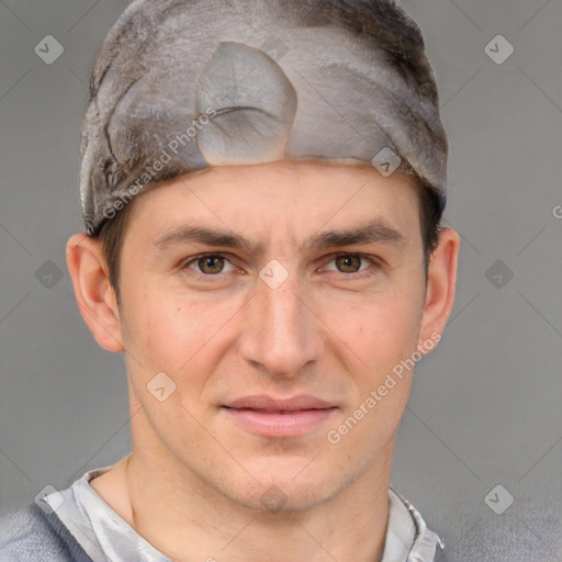 Joyful white adult male with short  brown hair and grey eyes