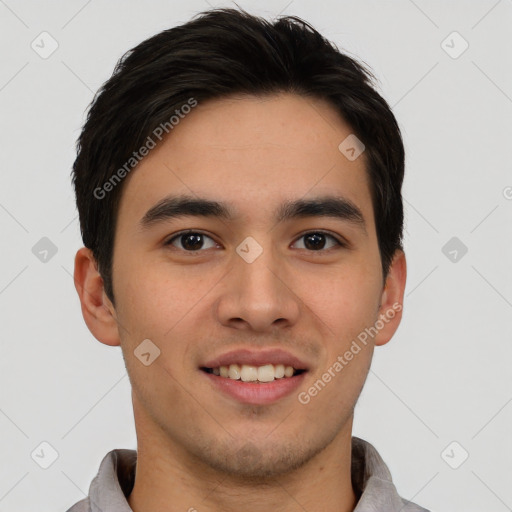 Joyful asian young-adult male with short  brown hair and brown eyes