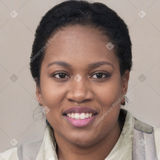 Joyful black young-adult female with short  black hair and brown eyes