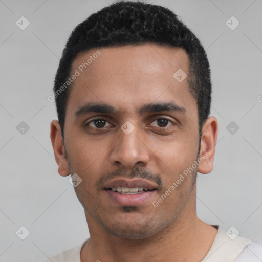 Joyful white young-adult male with short  black hair and brown eyes