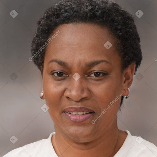 Joyful black adult female with short  brown hair and brown eyes