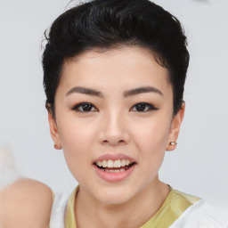 Joyful asian young-adult female with short  black hair and brown eyes