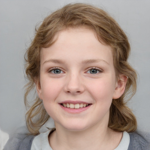 Joyful white child female with medium  brown hair and blue eyes