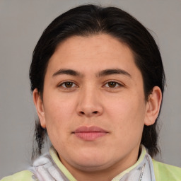Joyful asian young-adult female with medium  brown hair and brown eyes