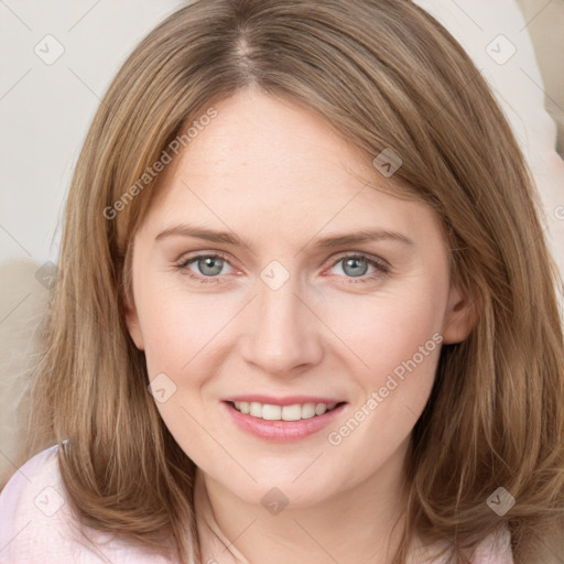 Joyful white young-adult female with long  brown hair and blue eyes