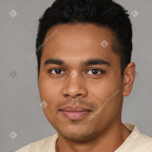 Joyful latino young-adult male with short  black hair and brown eyes