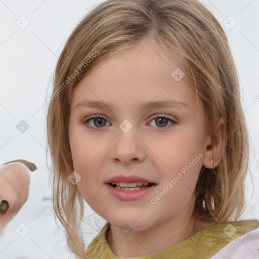 Joyful white child female with medium  brown hair and blue eyes