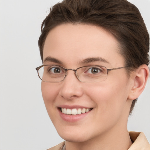 Joyful white young-adult female with short  brown hair and grey eyes