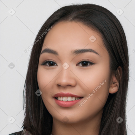 Joyful white young-adult female with long  black hair and brown eyes