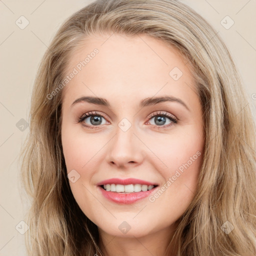 Joyful white young-adult female with long  brown hair and green eyes