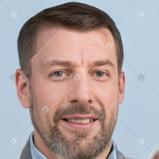 Joyful white adult male with short  brown hair and blue eyes