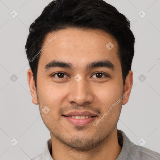 Joyful white young-adult male with short  black hair and brown eyes