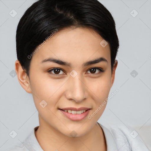 Joyful asian young-adult female with short  brown hair and brown eyes