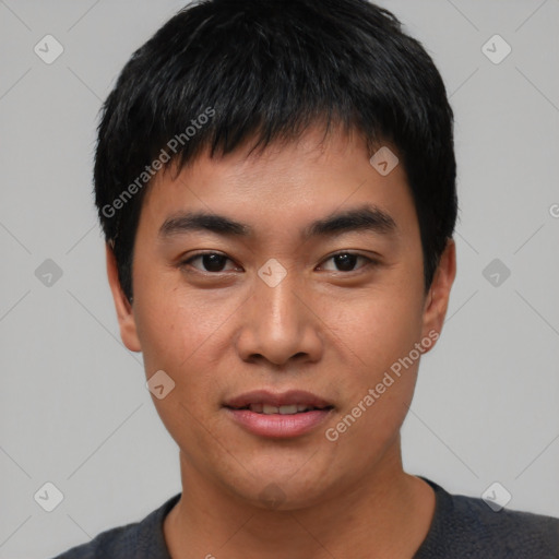 Joyful asian young-adult male with short  black hair and brown eyes