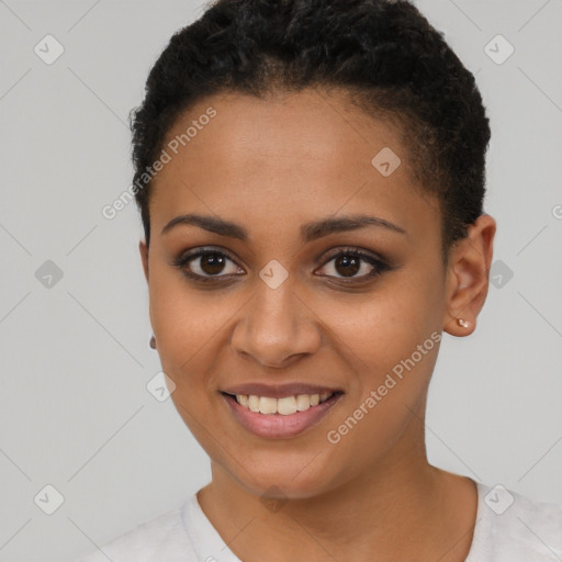 Joyful black young-adult female with short  brown hair and brown eyes