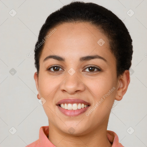 Joyful latino young-adult female with short  brown hair and brown eyes